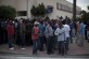 Los inmigrantes esperan  ante la Jefatura de Policia de Melilla para la entrega de la tarjeta temporal.